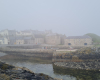 A sea haar gives an atmospheric view of the Old Harbour